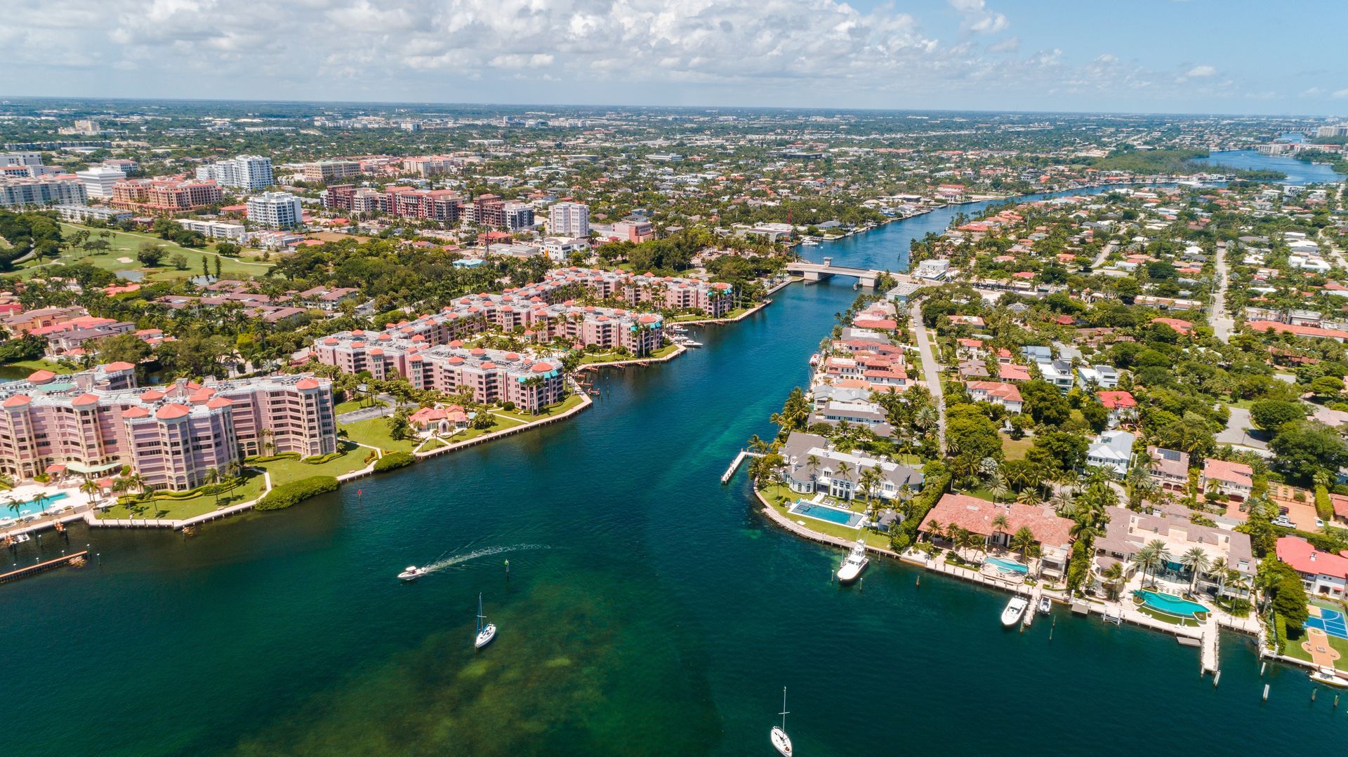 An aerial view of a city with a river running through it.